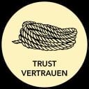 In der Mitte eines gelben Kreises befindet sich ein aufgerolltes Seil. Unterhalb des Seils stehen in schwarzen Großbuchstaben die Wörter TRUST und VERTRAUEN.